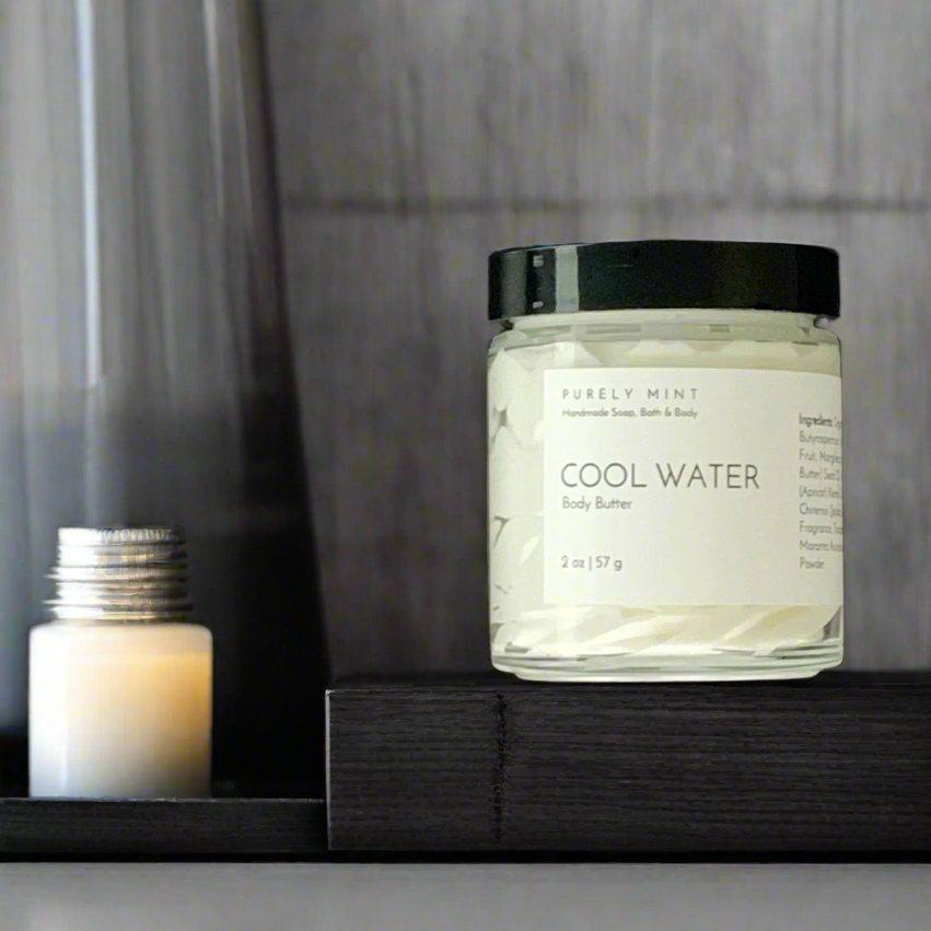 2 oz white body butter white label, black top, bathroom counter, manly tray, dark colors