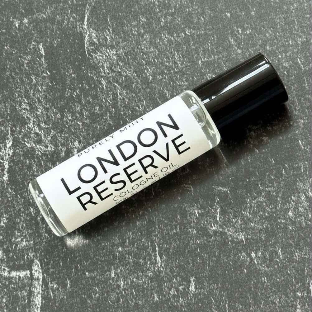 bottle of London Reserve Cologne Oil on a textured gray surface