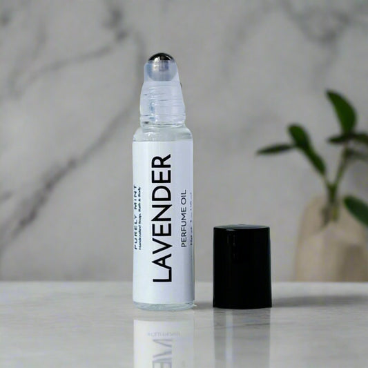 Perfume oil bottle, white label, metal roller, black top, in a modern bathroom, white marble, luxury, spa, plants, commercial advertising photography