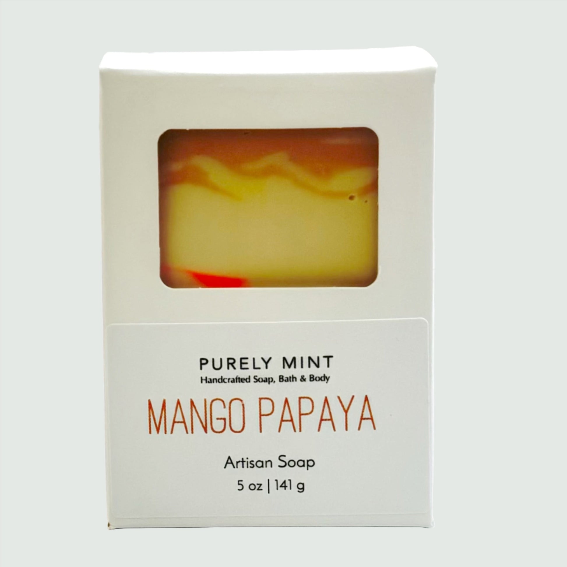 tan and pink soap in white box with white background.
