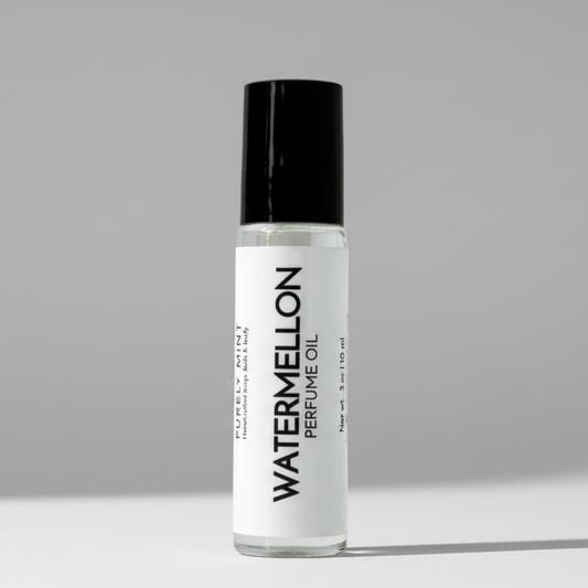 Perfume oil bottle labeled 'Watermelon' on a neutral background