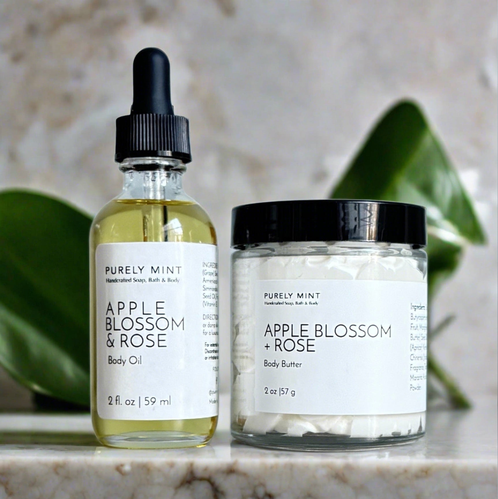 Apple Blossom & Rose body oil and body butter bundle in a modern bathroom, marble, luxury, spa, plants, commercial advertising photography