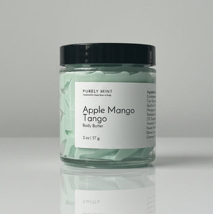 Apple Mango Tango body butter on a light gray seamless backdrop