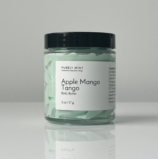Apple Mango Tango body butter on a light gray seamless backdrop