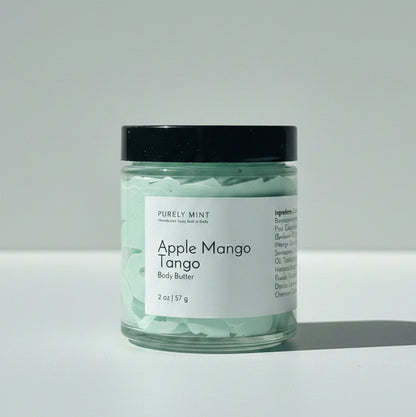 A jar of  Apple Mango Tango body butter on a light gray background.