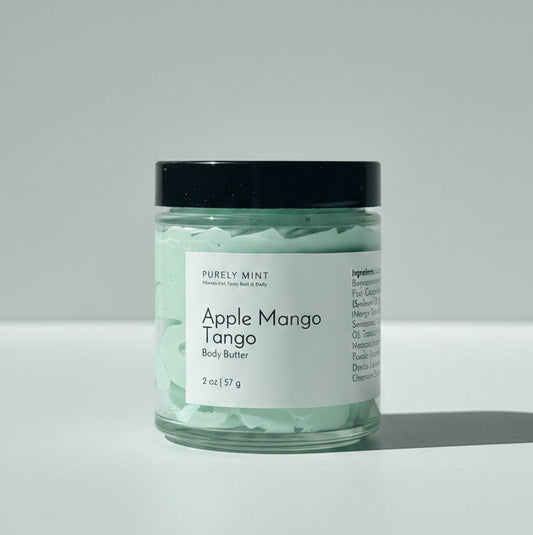 A jar of  Apple Mango Tango body butter on a light gray background.