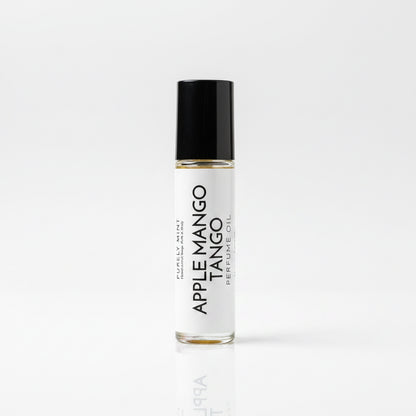 Perfume roller, white lable, black top, white reflective seamless backdrop.