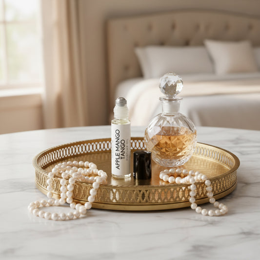 Perfume Roller, White label, metal ball, black top, in a modern bedroom on marble vanity with a gold tray, pearls and perfume on it. 