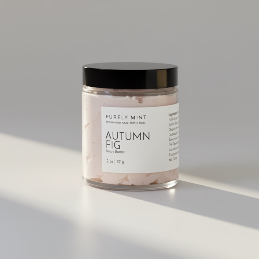 Jar of 'Autumn Fig' body butter with a black lid on a commercial photography packshot, light gray seamless backdrop, neutral lighting