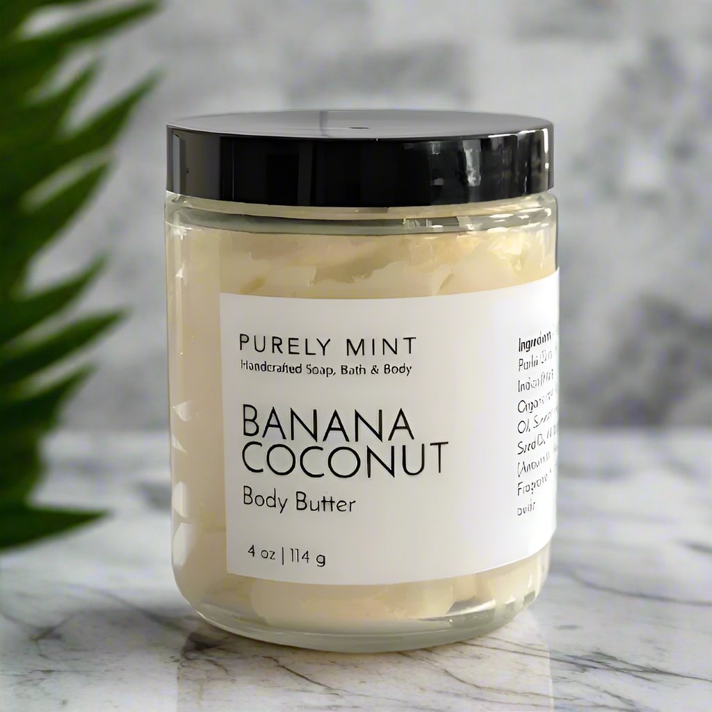 Yellow Banana Coconut  body butter  in glass jar, black lid, white label, in a modern bathroom, marble, luxury, spa, plants, commercial advertising photography