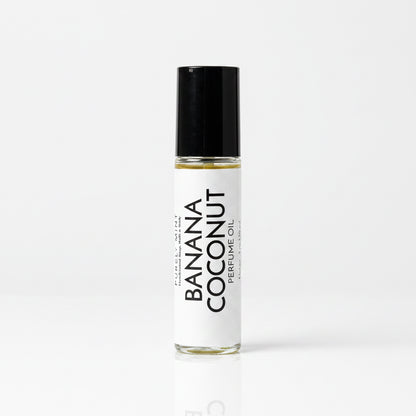 Perfume roller, whitr lable, black top, white reflective seamless backdrop