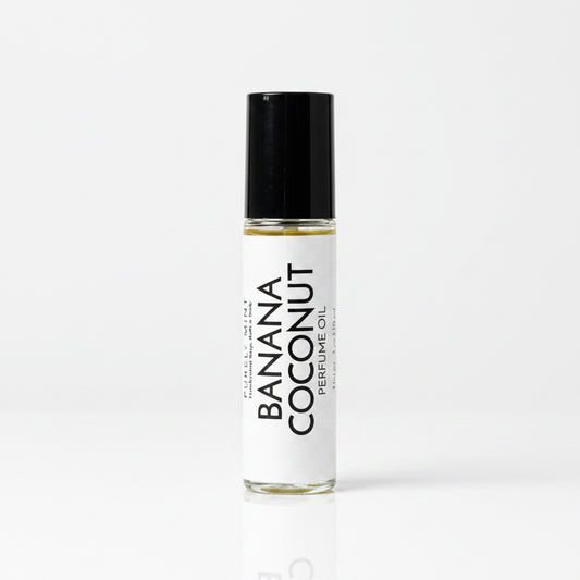 Perfume roller, whitr lable, black top, white reflective seamless backdrop