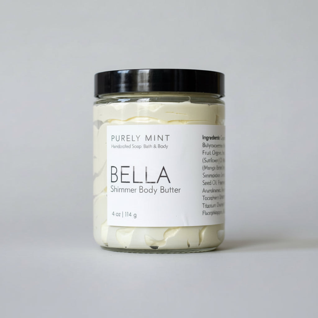 Jar of Bella body butter on a light gray seamless backdrop.