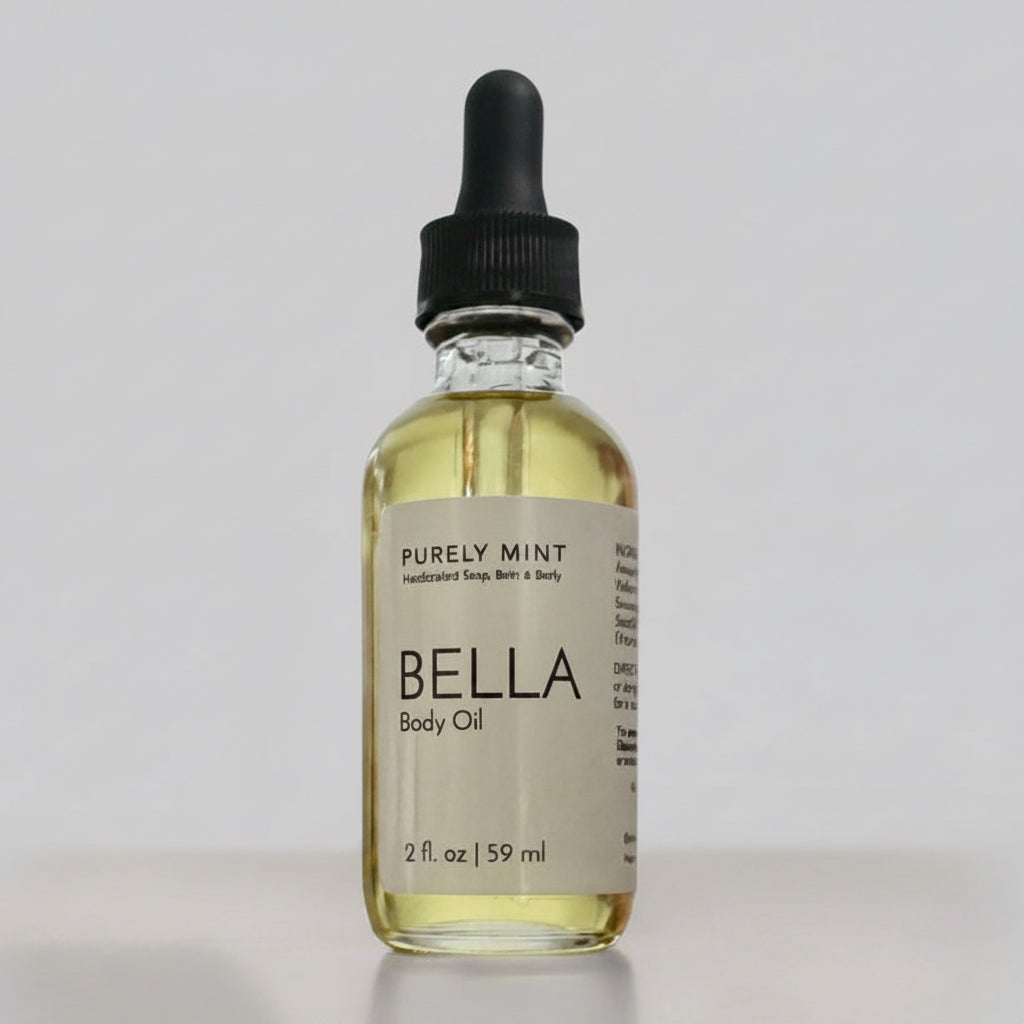 2 oz body oil, glass bottle, dropper top, light gray seamless backdrop, neutral lighting