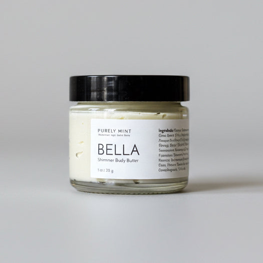 Jar of Bella Shimmer Body Butter on a light gray backdrop.