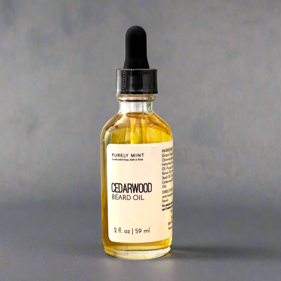 2 oz Cedarwood Beard Oil in a claear glass bottle, white label, glass dropper top in commercial photography packshot, charcoal gray seamless backdrop, neutral lighting