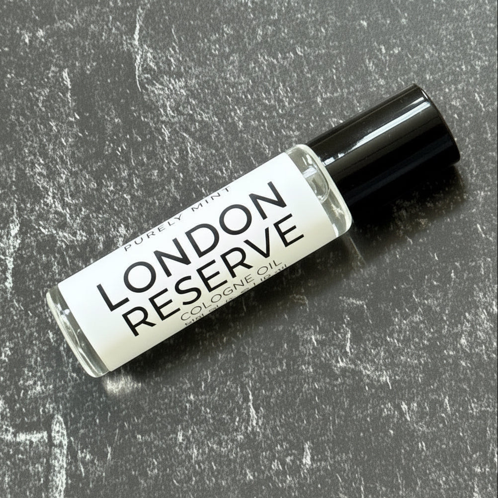 Small bottle labeled 'London Reserve' on a textured gray surface