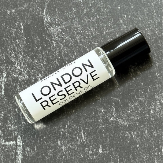 Small bottle labeled 'London Reserve' on a textured gray surface
