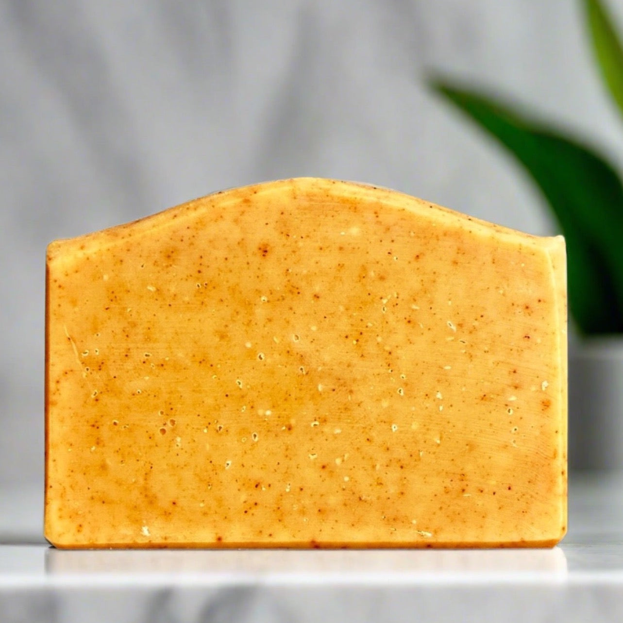 turmeric bar soap in a modern bathroom, marble, luxury, spa, plants, commercial advertising photography