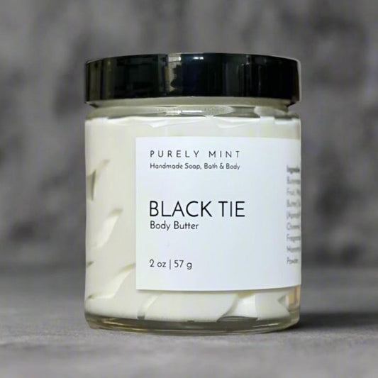 2 oz white body butter white label, black top, bathroom counter, manly tray, dark colors