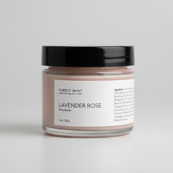 Jar of lavender rose body butter on a  light gray seamless backdrop, 