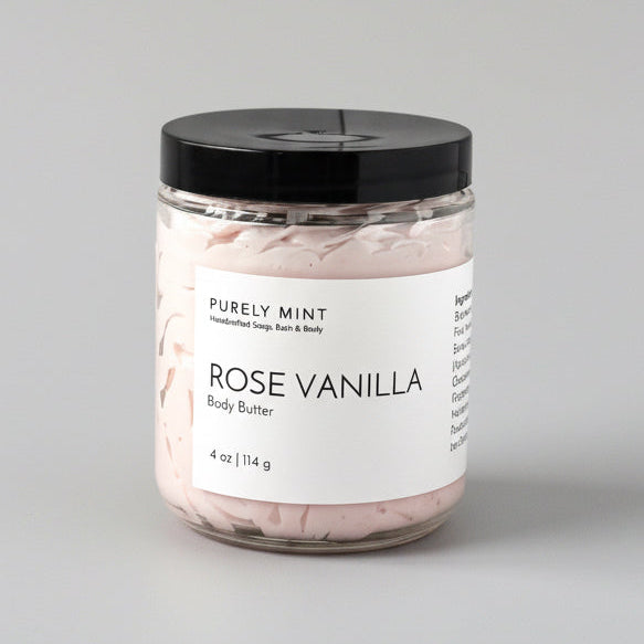Jar of rose vanilla body butter on a light gray seamless backdrop, neutral lighting