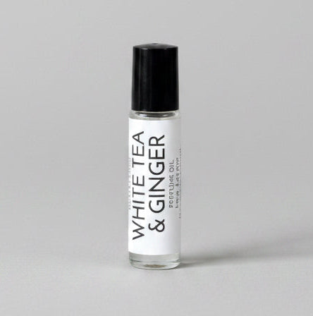 White Tea & Ginger Perfume Roller on a light grey backdrop.