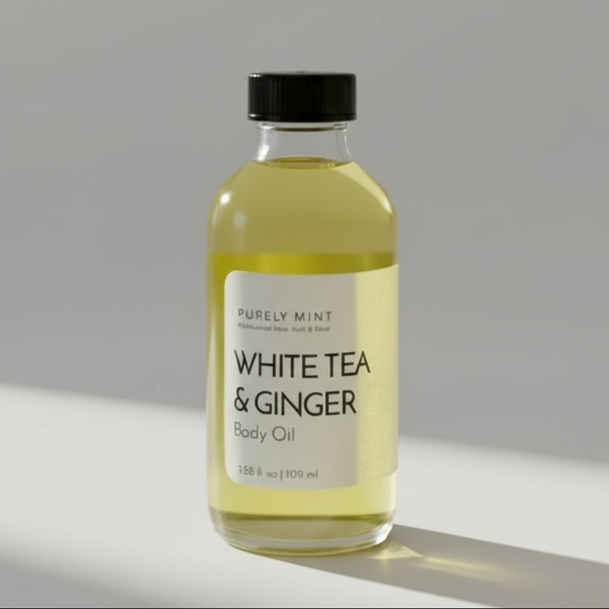 Bottle of White Tea & Ginger body oil on a commercial photography packshot, light gray seamless backdrop, neutral lighting