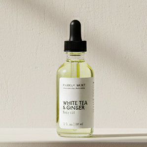 Bottle of Purely Mint White Tea & Ginger Body Oil in an advertising style shot, soft sun shadow, empty penthouse, scandinavian minimalism, neutral warm, detailed.