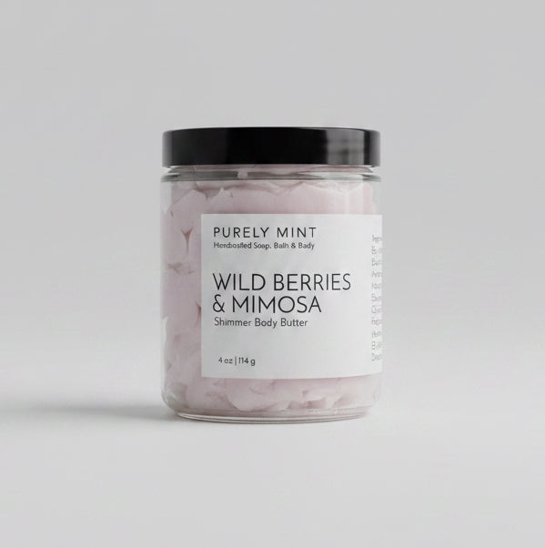 Jar of 'Wild Berries & Mimosa' body butter on a light grey backdrop.