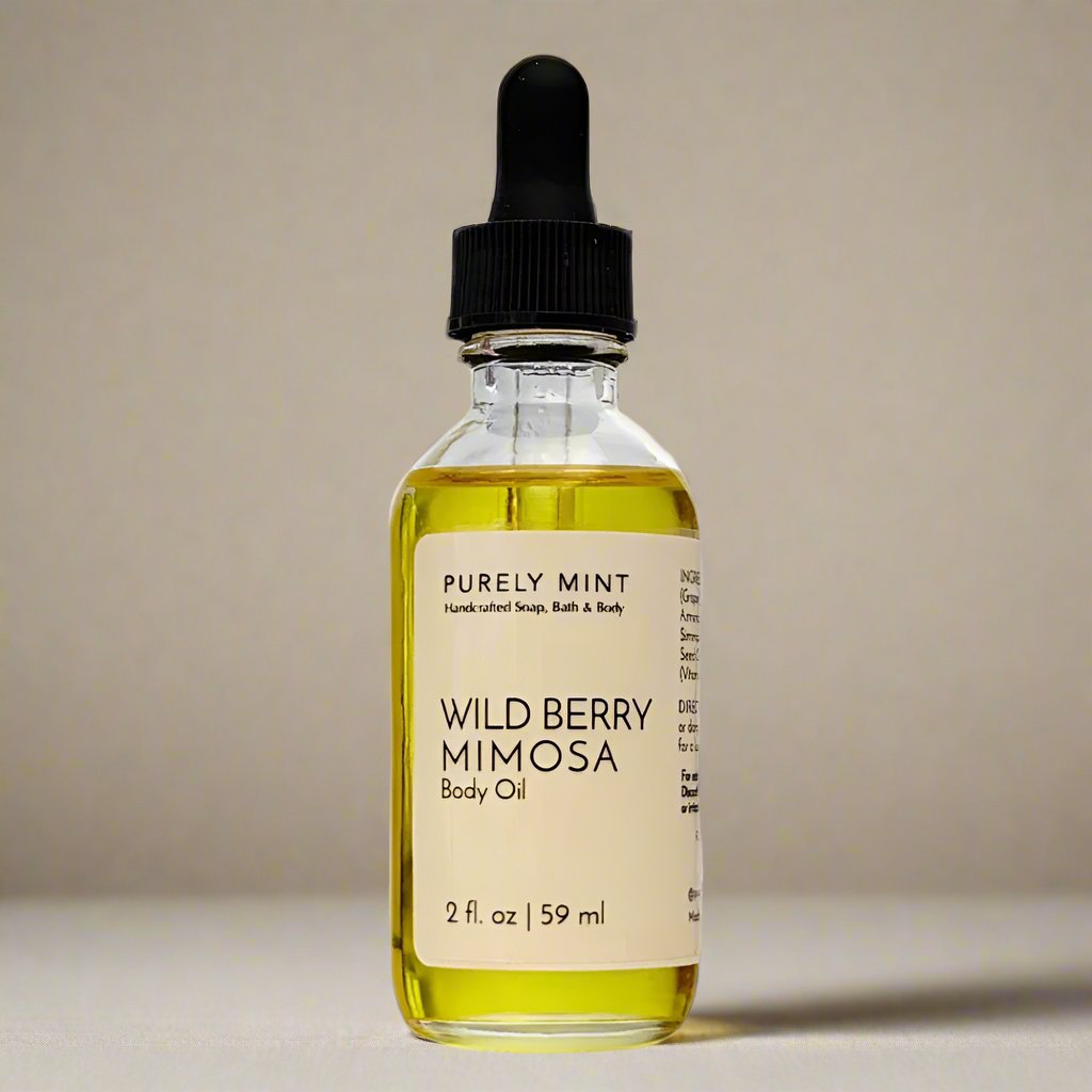 Wild Berry Mimosa body oil, clear glass bottle, white label, black dropper top. Commercial photography packshot, light cream seamless backdrop, neutral lighting