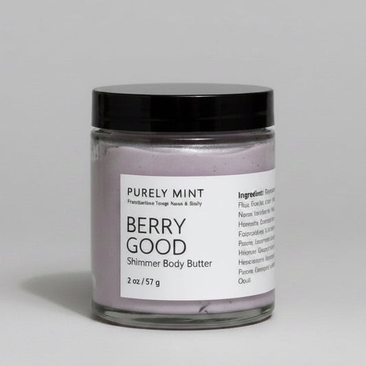 Jar of 'Berry Good' shimmer body butter with a black lid on a gray background.