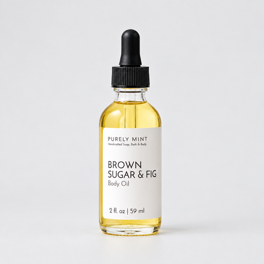 A  bottle of Purely Mint Brown Sugar & Fig body oil, featuring a minimalist label, set against a neutral background to highlight its natural aesthetic.