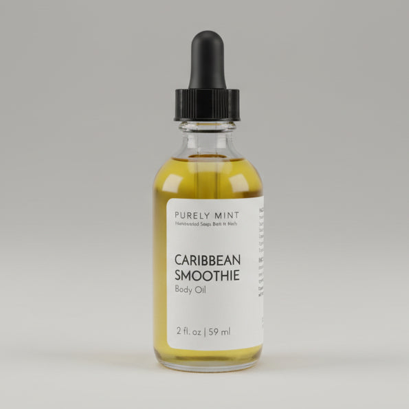 Bottle of 'Caribbean Smoothie' body oil on a commercial photography packshot, light gray seamless backdrop, neutral lighting.
