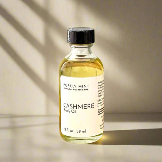 2 oz Cashmere Body Oil in a clear glass bottle wit dropper top, dvertising style shot, soft sun shadow, empty penthouse, scandinavian minimalism, neutral warm, detailed