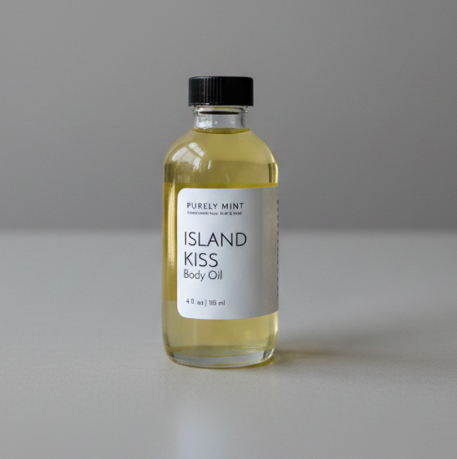 A 4 fl oz glass bottle of Purely Mint Island Kiss Body Oil with a black cap and white label, set against a neutral gray background.
